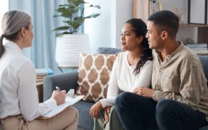 Couple meeting with a therapist to discuss relationship concerns