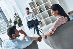 Couple speaking with a therapist during a professional counseling session